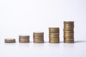 Stacks of coins isolated on white background, business and finance concept photo