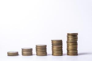 Stacks of coins isolated on white background, business and finance concept photo