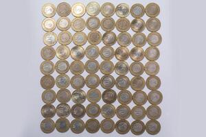 various Indian ten rupee coins background. Top view photo