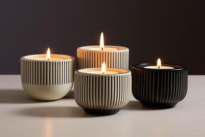 AI generated Four round striped candles burning, in cream, grey, and black holders on a light surface, isolated, against a dark grey background, creating a chic, elegant atmosphere. photo