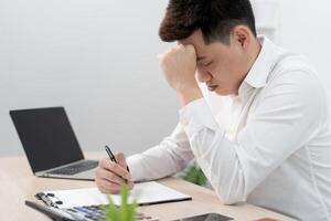 Depression and mental illness. Asian man disappoint, sad after receive bad news. Stressed boy confused with unhappy problem, arguing with girlfriend, cry and worry about unexpected work, down economy. photo