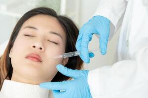 Cosmetic surgery, skin whitening injection, filler injection, Skin reface, beautiful Asian girls receive beauty treatments at beauty clinic, skincare, pore rejuvenation, wrinkle, baby face photo