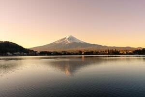 Mount Fuji at Lake Kawaguchi in the morning sunrise. Mt Fujisan in Fujikawaguchiko, Yamanashi, Japan. Landmark for tourists attraction. Japan Travel, Destination, Vacation and Mount Fuji Day concept photo