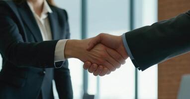 AI generated Businesswoman shakes the man's hand. No faces. photo