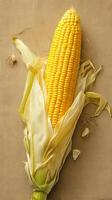 AI generated Single corn cob on brown sackcloth background, viewed from side Vertical Mobile Wallpaper photo