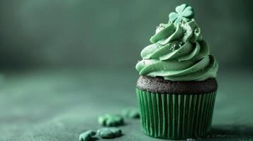 AI generated Patrick's Day cupcake with green frosting and a clover on a green background photo