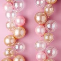 AI generated Beautiful festive minimalistic pink background with gold and clear balloons on the sides photo