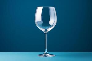 AI generated A single isolated wine glass on a blue surface reflecting the surroundings and background. Copy space. photo