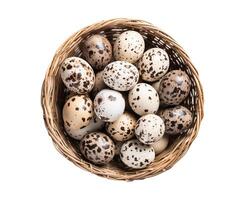 AI generated Isolated Quail eggs in a basket on white background. photo
