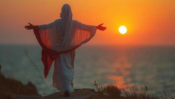 AI generated man in a white robe with a red shawl on his head against the background of the setting sun. photo