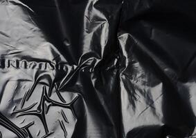 Texture of black crumpled cellophane photo