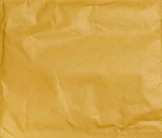 Yellow crumpled paper texture photo