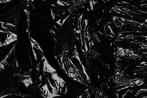 Crumpled black polyethylene, full frame photo