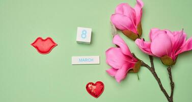 Textile red lips and cubes with the inscription March 8th, International Women's Day. photo