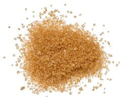 Brown cane sugar granules on isolated background photo