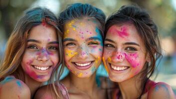 ai generado Tres joven mujer cubierto en vistoso polvo celebrando holi festival foto