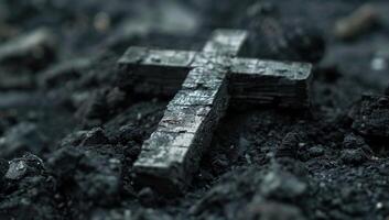 AI generated Charred wooden cross laying on dark soil photo