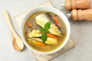 Pindang serani, fish soup with sour and spicy salty spices. Indonesian Food photo