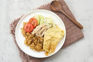 Nasi Goreng Telur Dadar, popular traditional Indonesian street food photo