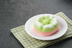 Kue Putu Ayu, a traditional Indonesian snack made from rice flour, suji leaves, pandan leaves, grated coconut then steamed, sweet and savory. photo