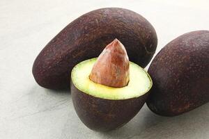 Whole and half of Alpukat or Avocado, ripe and fresh photo