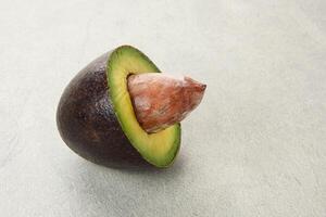 Whole and half of Alpukat or Avocado, ripe and fresh photo