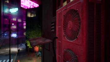 A red air conditioner sitting on the side of a building video