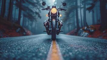 AI generated Black custom motorcycle parked on an empty foggy road in the middle of a misty forest with yellow line down the center of the road photo