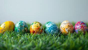 AI generated Colorful easter eggs on green grass background with copy space. photo
