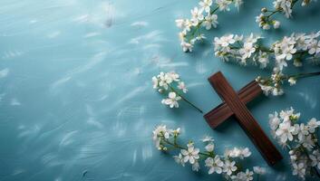 AI generated Wooden cross and white flowers on blue background. Easter concept. photo