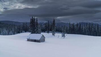 Time lapse of storm Clouds move over the mountains and the village of shepherds in winter. 4K video