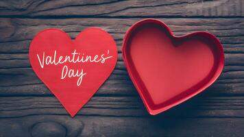 AI generated Valentines Day image with red heart ribbon on wooden background photo