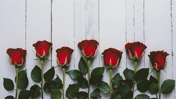 ai generado elegante frontera de pocos rojo rosas en contra prístino blanco fondo foto