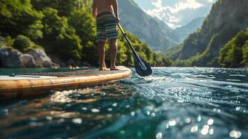 AI generated Man enjoys paddleboarding in serene mountain lake photo