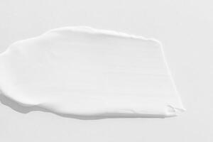 large smears of white cosmetic cream. The texture of the cream close up. photo