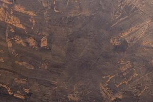 Abstract Composition, Dark Stone Surface with Traces of Cocoa Powder. photo