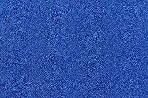 Vibrant Blue Football Turf Texture, Close Up Shot with Soft Focus Background photo