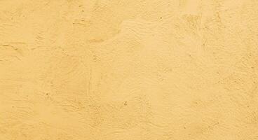 Abstract background of sunlight, light, and shadow on a stucco concrete wall. photo