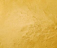 Gleaming Gold Textured Metallic Background. photo