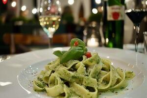 AI Generated green broccoli pasta sits on a white plate in a modern restaurant photo