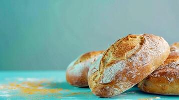 AI Generated Close-up of three freshly baked buns on the blue table, minimalism style with copy space photo