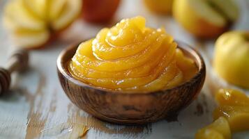 AI generated Honey with apple fruit pureed in a bowl on a wooden table photo