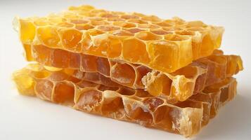 AI generated A close-up of a fresh honeycomb on a white background photo