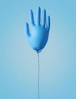 Cleaning concept. An inflatable ball in the form of a glove for cleaning on a blue background. Spring cleaning. photo