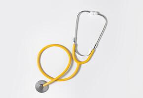 Yellow stethoscope on a light background. Concept of medicine. Health Day. photo