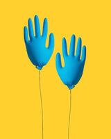 Cleaning concept. Gloves for cleaning in the form of an inflatable ball on a yellow background. Creative idea. photo