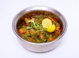 chicken mughlai handi served in dish isolated on grey background top view of pakistani food photo