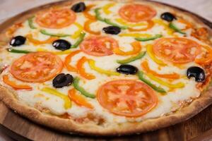 Arabic Veg pizza served in cutting board isolated on background top view of fast food photo