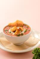Classic Tomato Soup with eggs served in a dish isolated on background side view of fastfood photo