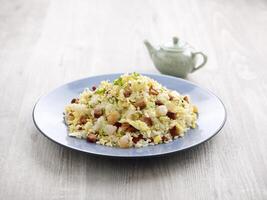 Yang Zhou Fried Rice with chopsticks served in a dish isolated on mat side view on grey background photo